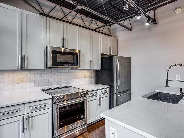 Make your culinary dreams a reality in this elegantly designed galley kitchen.