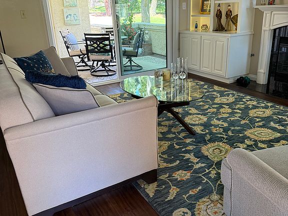 living room feels larger with oversized patio!