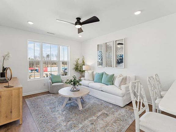 The family room of the Morgan townhome model by Brookfield Residential at Wendell Falls.