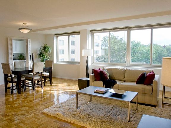 Dining and living area with hardwood flooring