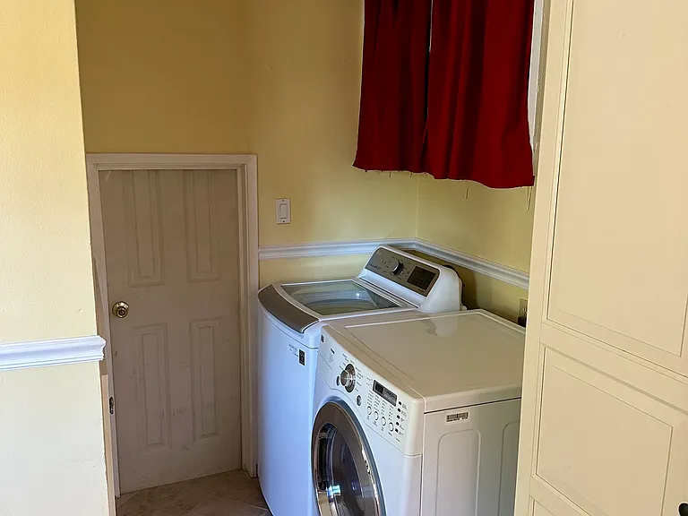 Washer dryer, storage, garage entry.