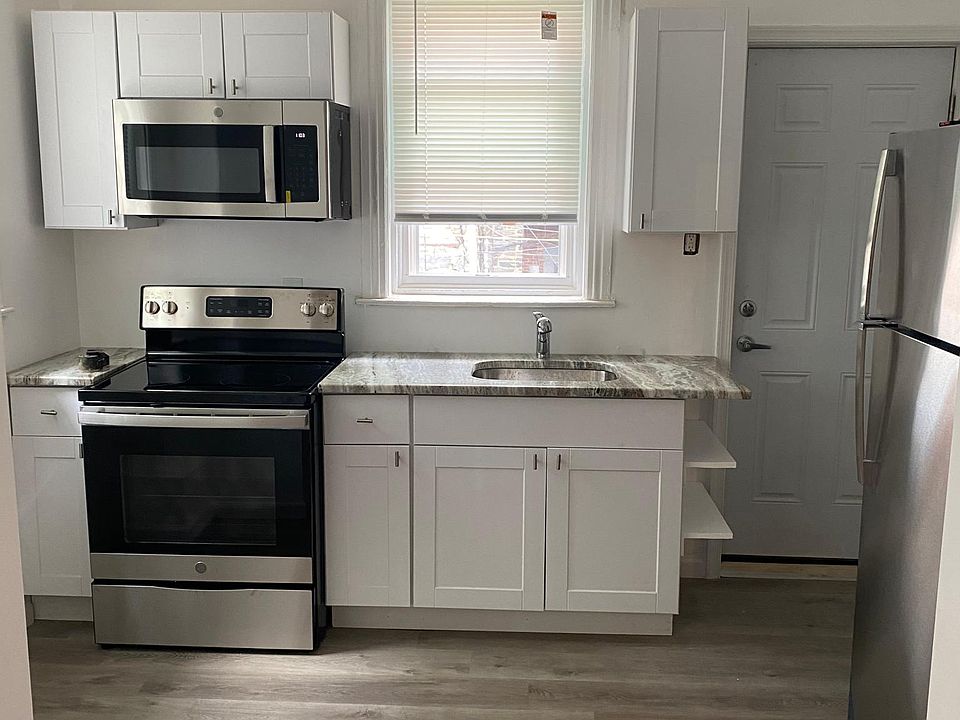 Newly renovated kitchen added shelving for space.