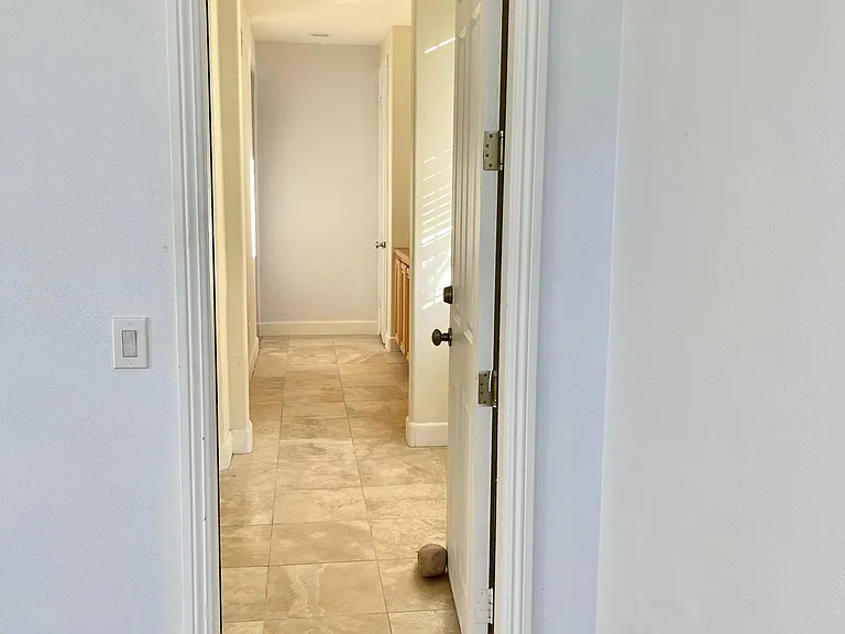 Hallway to Bedroom and Kitchen