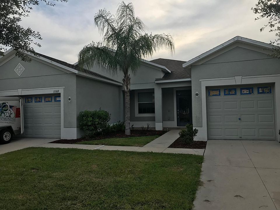 Front yard.  Two garages.  One is a two car, the other is a 