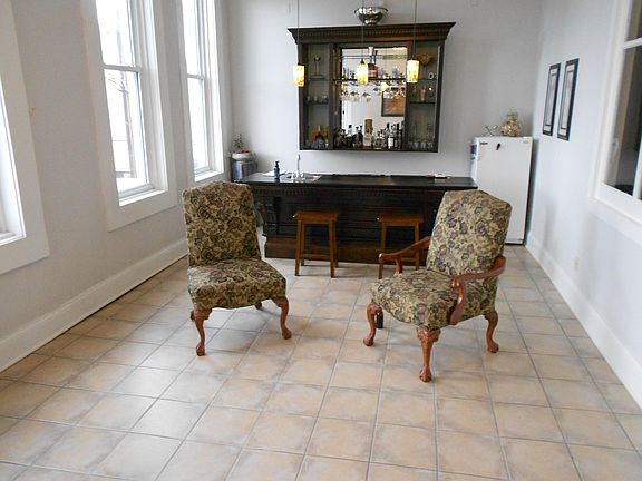 A bar room accessible from the outside porch, equipped with a wet bar.