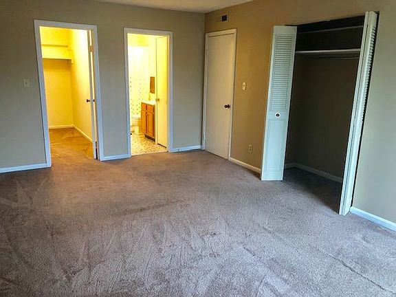 Master bedroom with walk-in closet, private bathroom, and extra regular size closet.