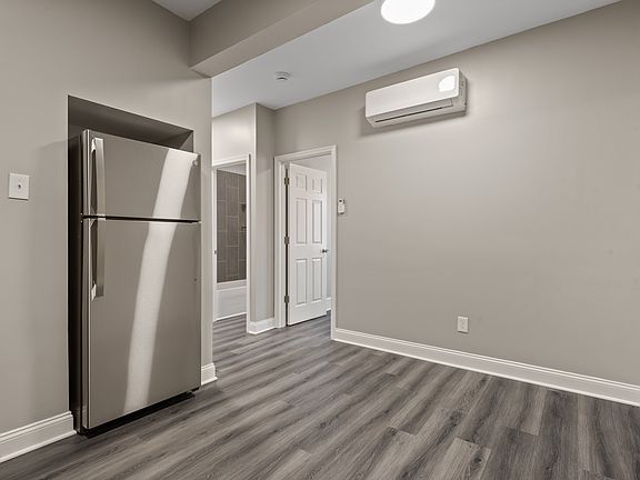 Kitchen with dishwasher, new cabinets, new appliances and quartz countertops.