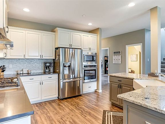 2 convection ovens in this kitchen - one under the cooktop, the other a wall oven to the right of the refrigerator.