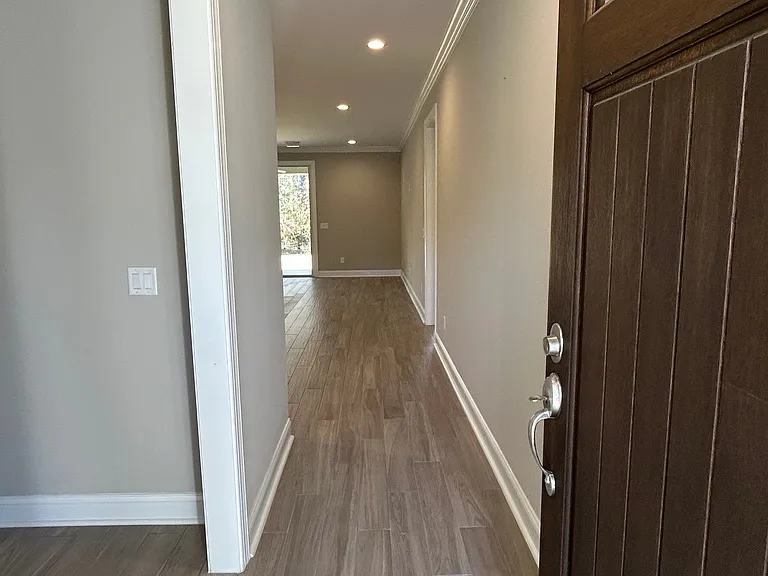 Enter from the front door, office/dining/den on left with hall leading to kitchen and living area