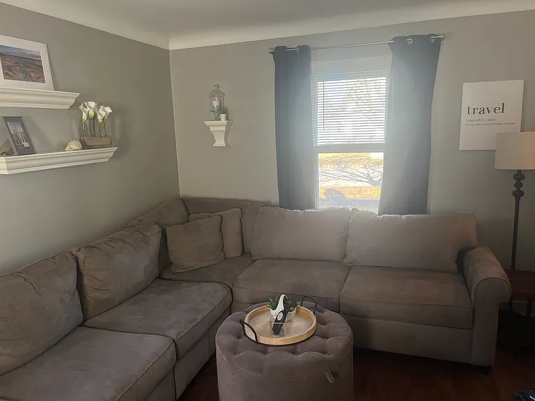 Furnished extra large 7 Seat Sectional Couch with larger Cuddler seat at end.