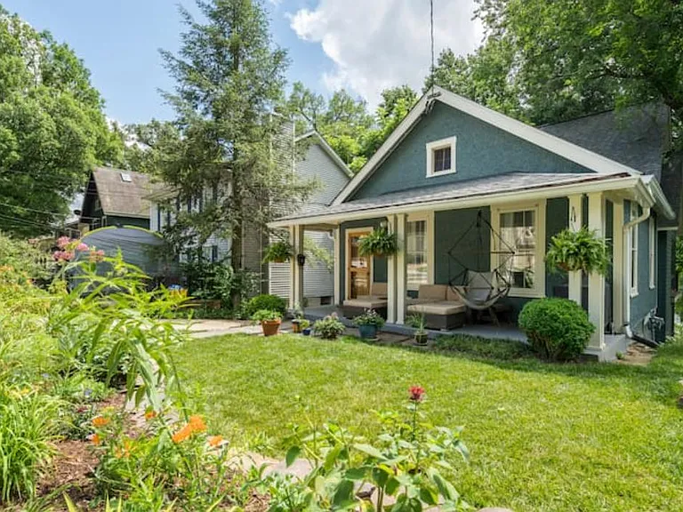 The front of our home in full-bloom summer.