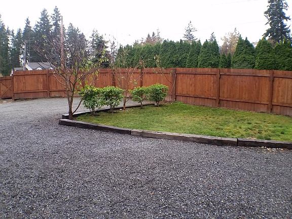 Low maintenance yard with parking for 6 or more plus RV spac