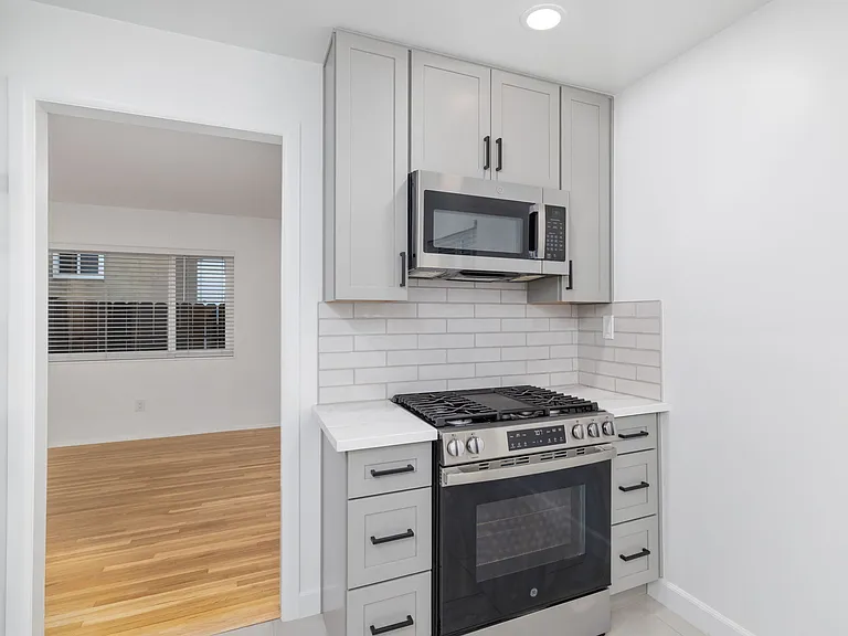 Gas range stove and matching over-the-range microwave.