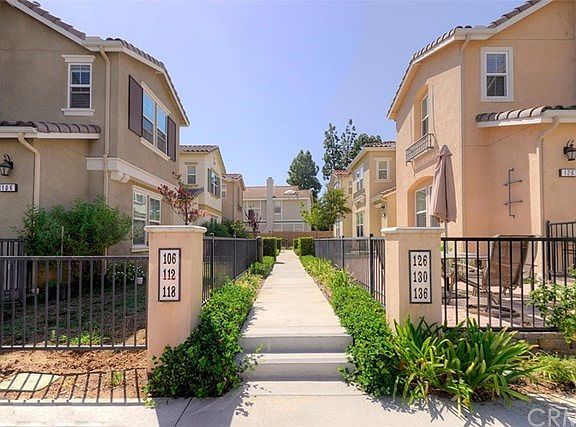 The illuminated address posts announce the location of the Bradford Court residences.  118 Tiger Lane is at the far left end.  Six stylish single family homes are located on each courtyard.