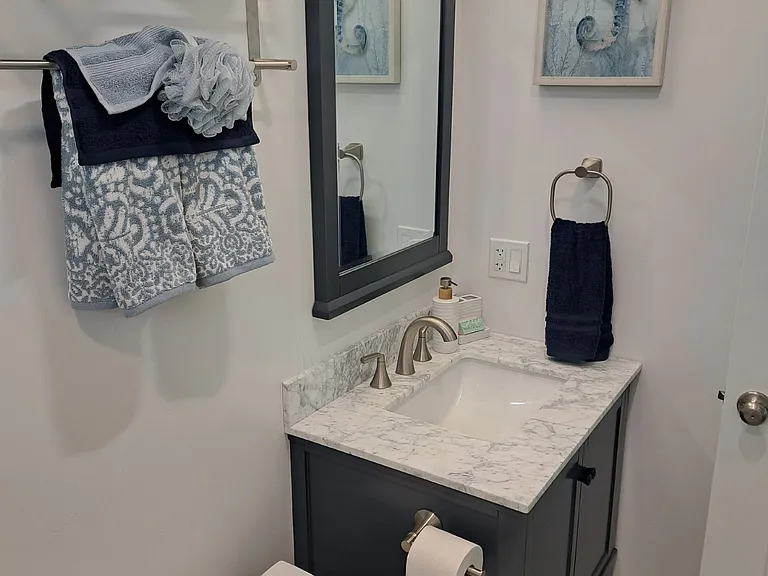 Bathroom with shower, custom tile, brush nickel finishes