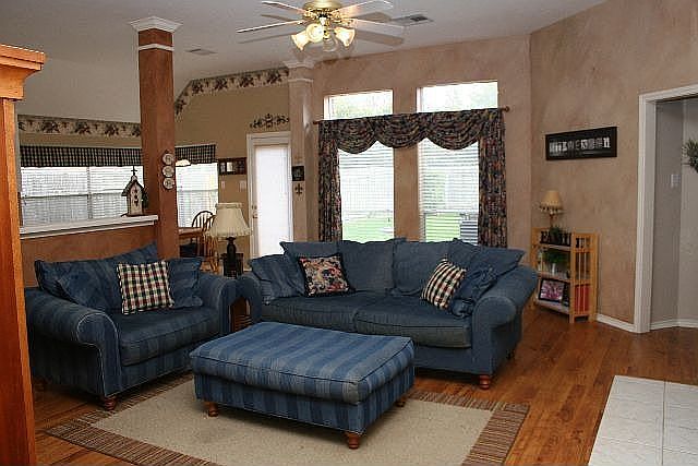 high ceilinged living area w. fireplace