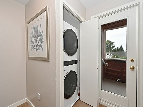 New Washer-dryer on 2nd floor next to large bedroom / office and door to enclosed deck / sunroom