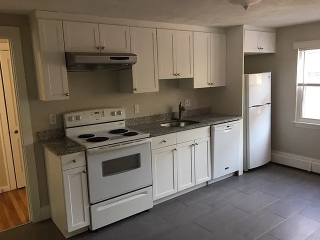 Updated kitchen with newer appliances, granite counter and nice ceramic tile flooring.