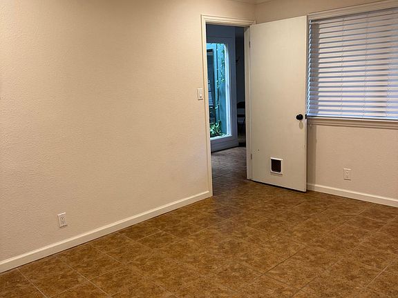 Bonus Room.
-cat door into this space
-washer and dryer hookups
-hot water heater closet 
-small storage closet
-entrance into the garage from the house