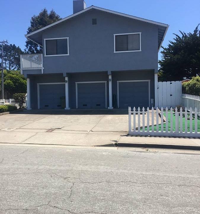 The unit is the one pictured above the garages and the garage with laundry is the one on the bottom left
