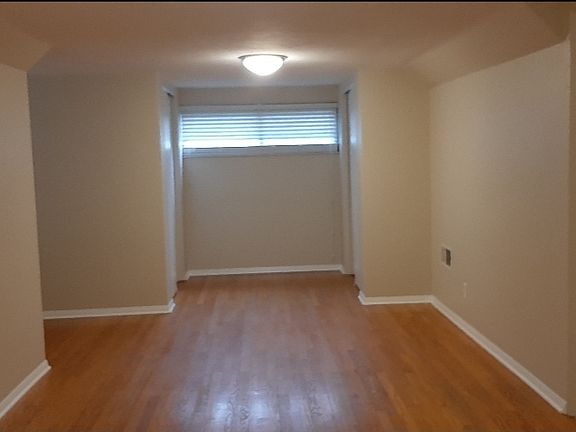 Upstairs. Large bedroom. Three large closets and half-bath upstairs. Beautiful hardwood floor.
