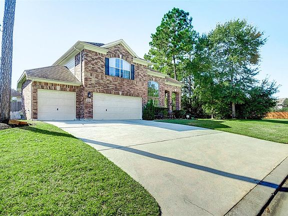 This home sides to a wooded green belt, has a wide driveway and a 3-car garage.