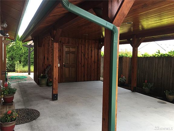 Solid Wood Fence and Gates Surround The Property Keeping Pets and Children Safe. Constructed in 2013. Lots of Sun and Shade With Seating.