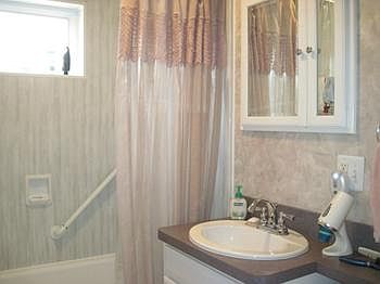Updated bathroom with ceramic floors.