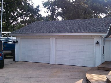 Large 2 1/2 car garage with new hurricane doors