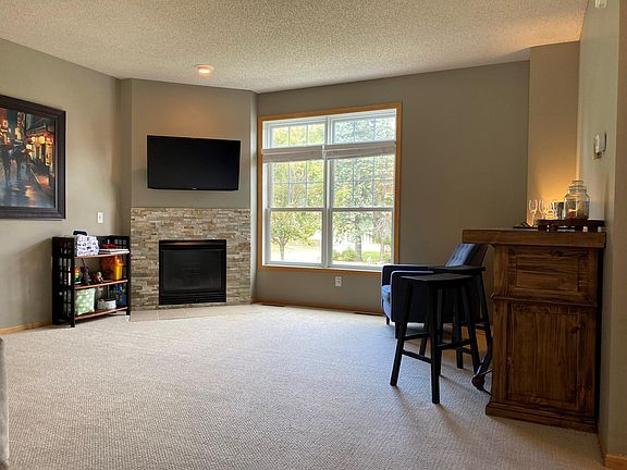 Large window in living room looks out to open green space and gorgeous trees! Samsung flat screen already mounted so you don't have to wait to Netflix and chill!