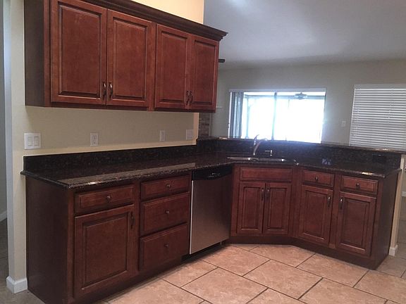 Left view of kitchen. Area behind kitchen can be used as dining area. Master bedroom is to right