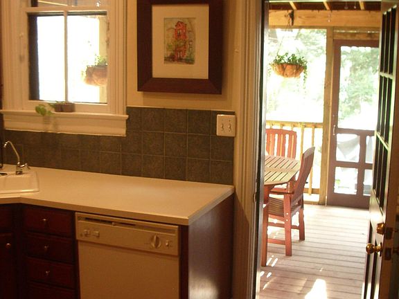 Large kitchen opens onto screened porch