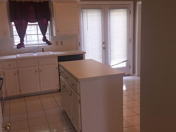 Eat in Kitchen with French Doors to the Fenced Backyard and