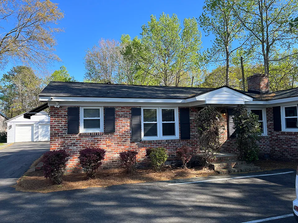 Private residential entrance with two parking spaces included.