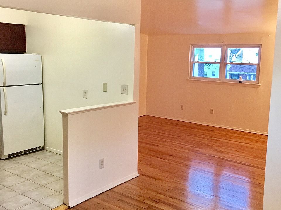 View from dining room into living room & kitchen