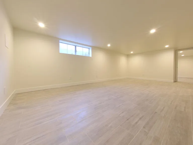 Basement Living area looking towards basement master.
