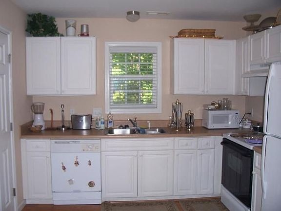 Sunny kitchen with hardwood laminate floors