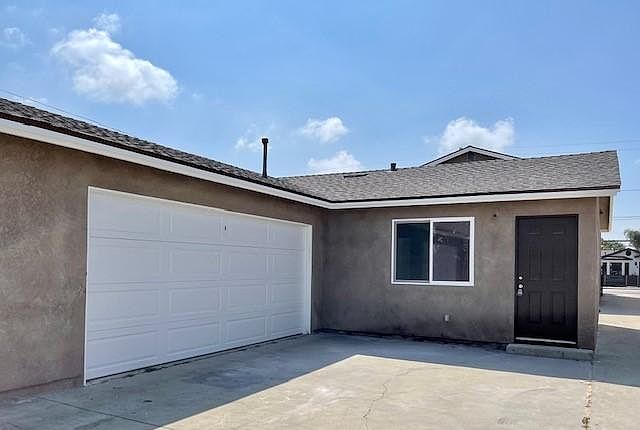 Outside with 2 car garage