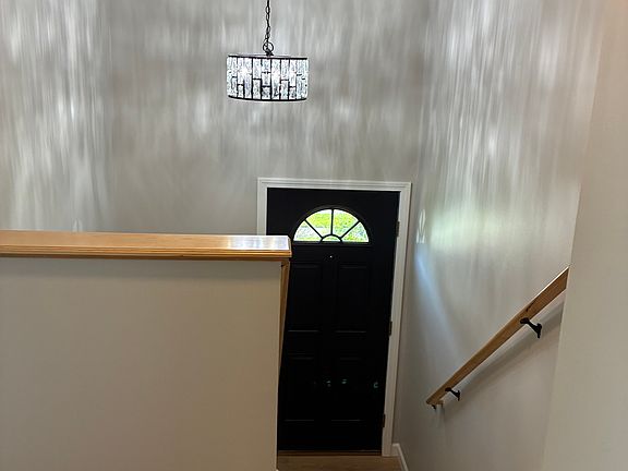 stairwell with new lighting throughout unit.