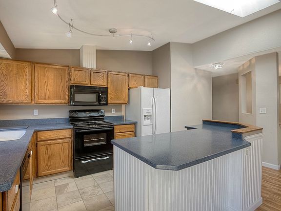 Corian Countertops & Skylight (one of 3 in home) that Opens for Fresh Air!