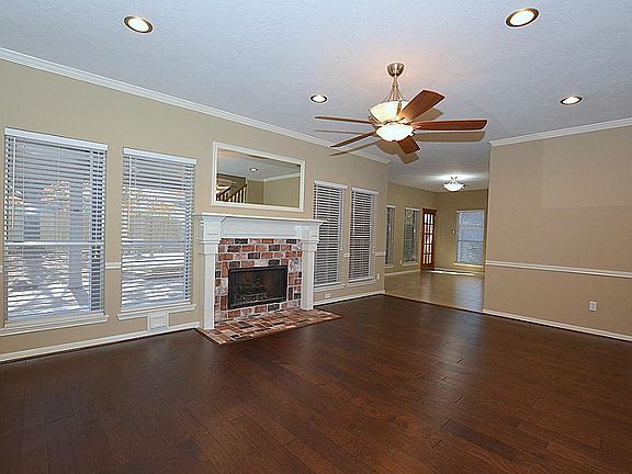 Great view of the covered patio and custom deck with seating (12/14). Family room leads to the breakfast area. Breakfast area has updated tile floors, light fixtures, new LED recessed lighting (07/14), and fresh paint (01/15).