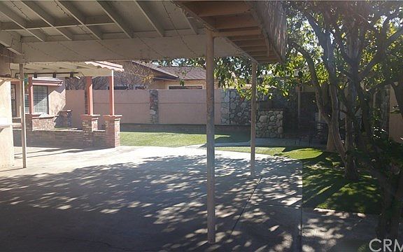 Entertainers Dream!!! Private Back yard. Covered patio. Covered Carport. Newer artificial turf. Ston