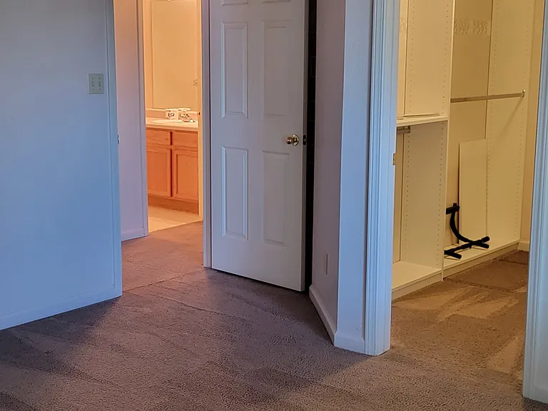 Master Bedroom view of hallway and master closet