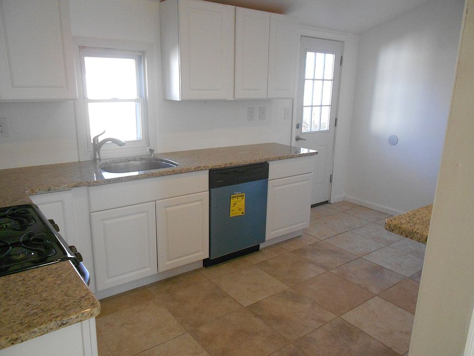 Kitchen With vaulted ceilings and sky light
