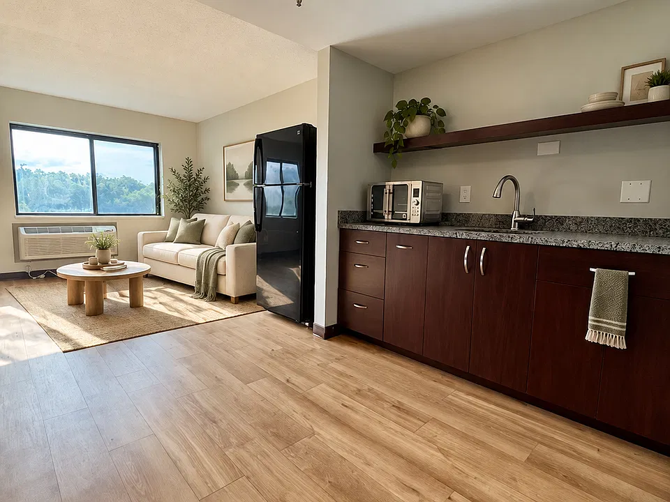 Studio kitchen and living - virtually staged; furnishings not included; finishes vary.