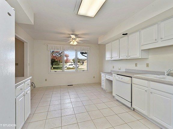 Double oven, newer refrigerator, dishwasher, and microwave all stay!