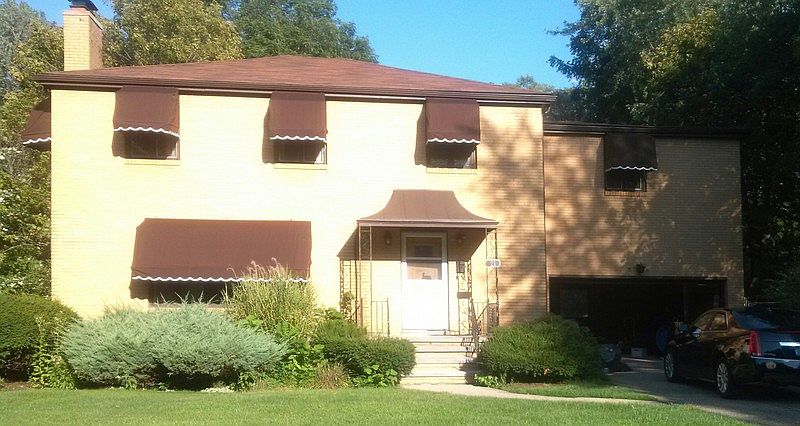 Front of house - faces west : Kohler custom awnings - sun until mid day on backyard pool