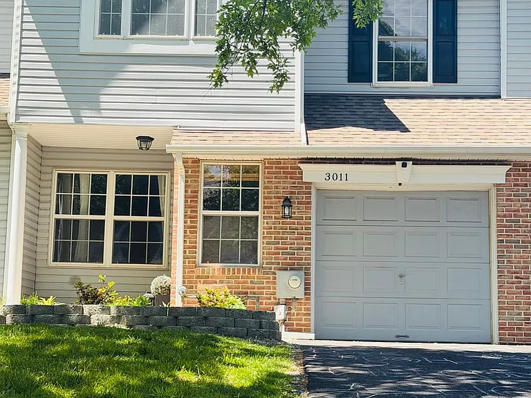 Facade view with garage and 2 car driveway