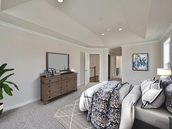 Master bedroom with coffered ceiling and two closets