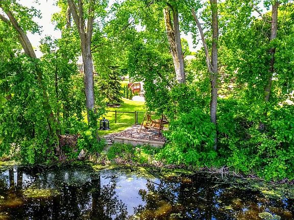One of a kind property with pond in the backyard